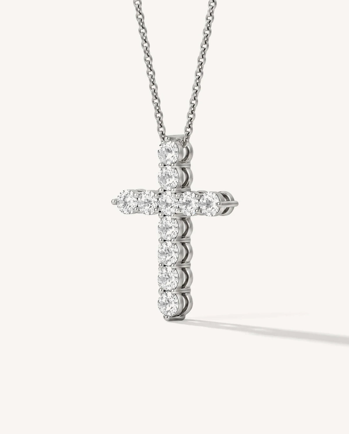 Lab-grown diamond cross pendant in 14K gold, side view showing shared-prong setting